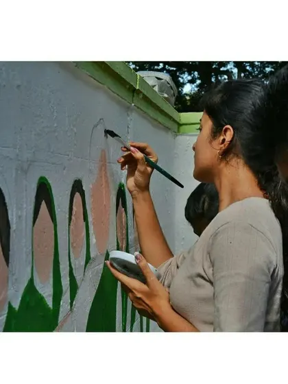 Working side-by-side with my team on a large-scale project. Collaboration is key to creating cohesive and impactful murals, especially for public art installations.