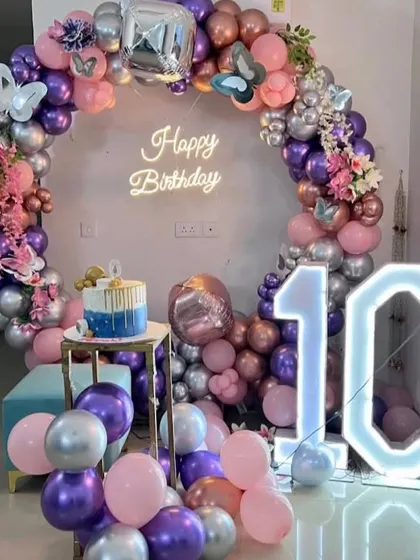 A duplicate of the 10th birthday setup, showing the full arrangement with the cake and marquee number.
