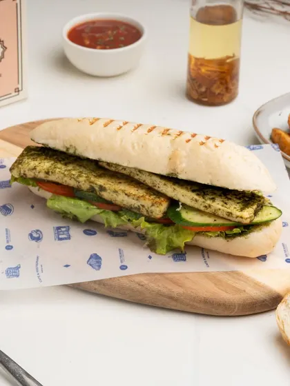 The Grilled Paneer Panini is a fantastic vegetarian option, with thick slices of marinated paneer and fresh vegetables pressed in a classic panini.