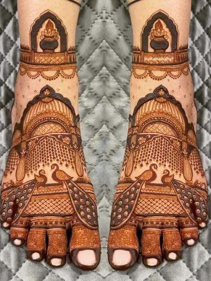 A beautiful and symmetrical foot design featuring peacocks and architectural motifs.