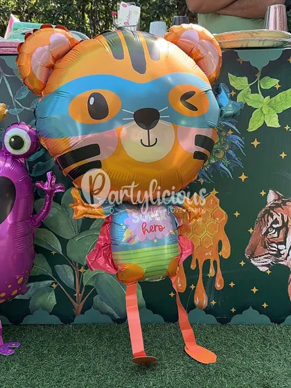 A cute superhero tiger balloon, part of the fun and imaginative decor at our festival play zone.
