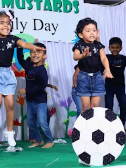 An action shot of the children jumping with joy during their dance.