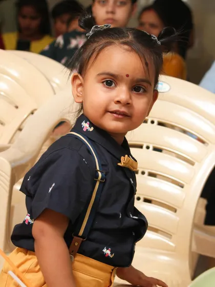 A candid shot of the birthday girl looking curious. I move around the event space to capture children in their natural element.
