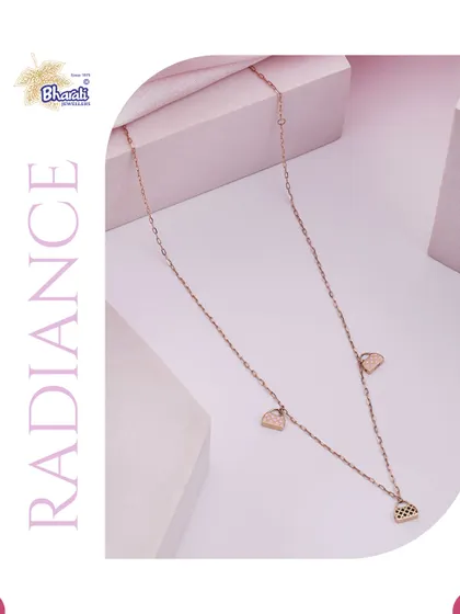 A delicate rose gold chain featuring small, fan-shaped charms, embodying radiance and grace.