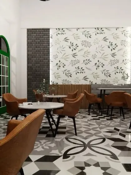 A perspective from a corner of the cafe, showing how the arched green windows add a pop of color and character. Every seating area is designed to feel a little different, giving customers a unique experience with each visit.