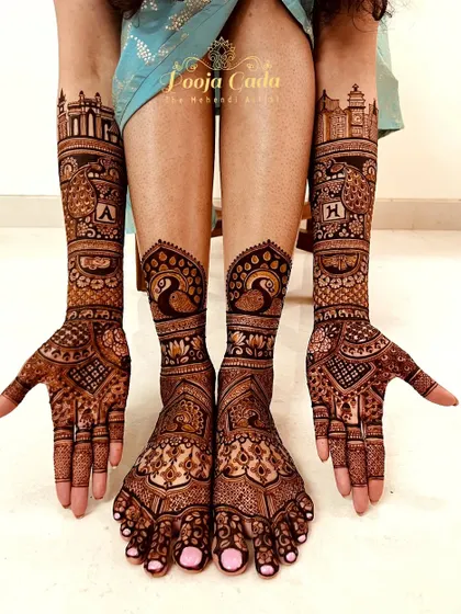 The full bridal set for our NRI bride from the US, with coordinated peacock and architectural designs on hands and feet.