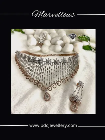 A marvelous diamond choker necklace set with a unique dangling design. The combination of rose gold and white gold with sparkling diamonds makes this a contemporary choice for a modern bride.