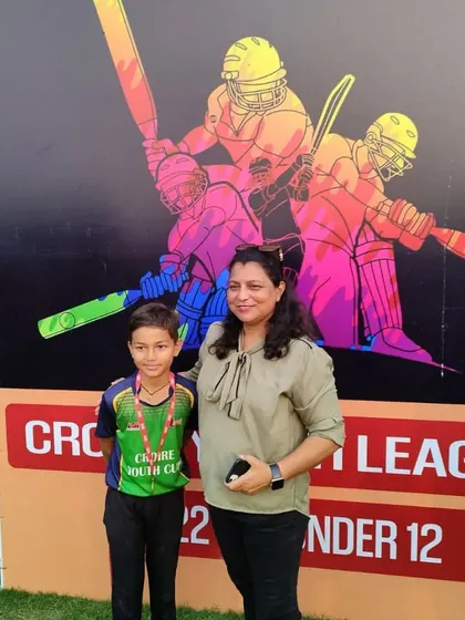 A proud mother with her son after he received an award. These are the moments that make all the hard work worthwhile.
