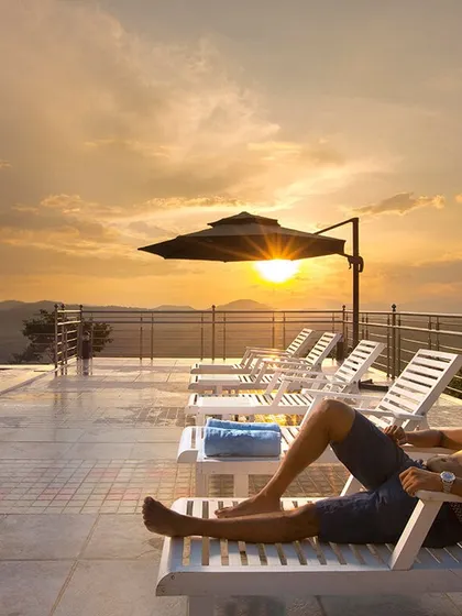 Soaking in the sunset from the infinity pool at Coorg Cliffs Resort. This is the kind of luxurious relaxation I can arrange for you, with panoramic views of the Western Ghats.