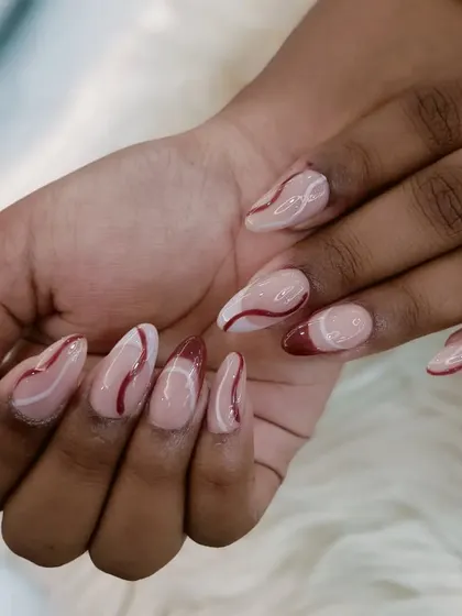 A sophisticated abstract design with a sheer base and delicate swirls of white and deep red.