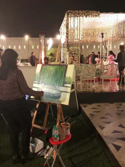 Painting on-site at a beautiful outdoor wedding in Delhi. The stage is set, and I am capturing the decor before the Varmala ceremony begins.