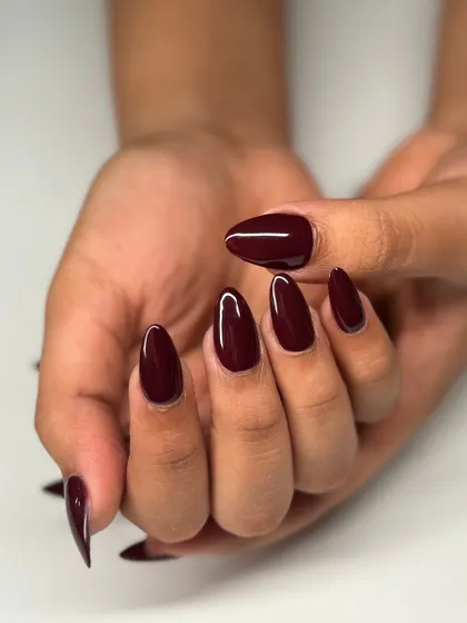 The full two-hand view of this classic and chic burgundy manicure. It's a color that never goes out of style.