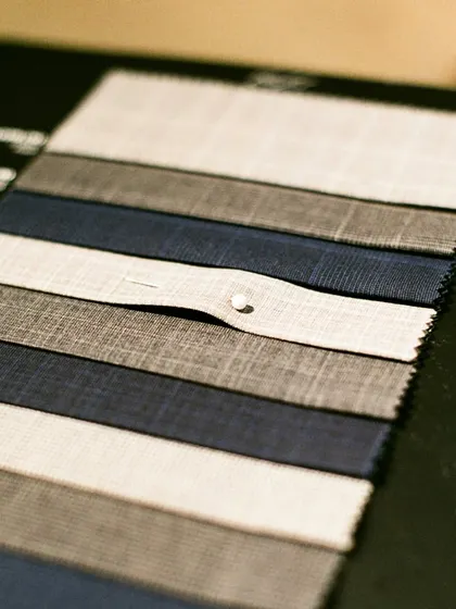A look at fabric swatches for suiting. The texture, weave, and color are the foundational elements of a bespoke suit, and I guide you in selecting the one that will become a staple in your wardrobe.
