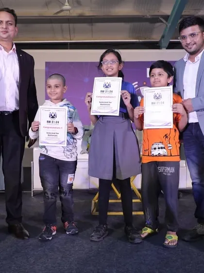 Three of our youngest competitors receiving their awards on stage. We believe in encouraging talent from an early age, providing a supportive platform for them to shine.