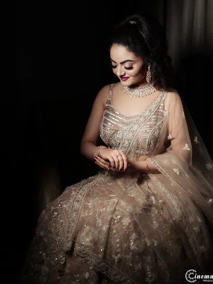 A beautifully lit portrait of the bride-to-be, highlighting her stunning jewelry and makeup.