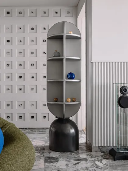 Another angle of the living room's totem shelf, set against the backdrop of the Morse code wall.