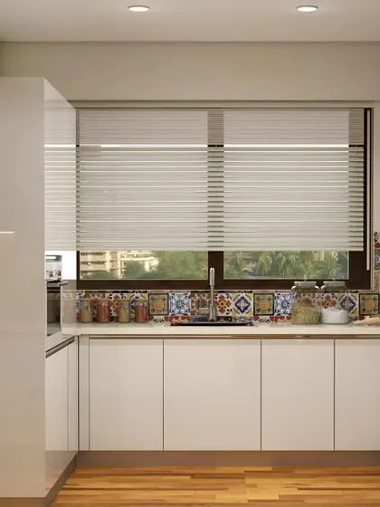This U-shaped kitchen is designed for a narrow space, making use of three walls for maximum efficiency. The all-white, glossy cabinets and a large window help make the area feel open and bright, while the patterned tile backsplash adds a creative touch.