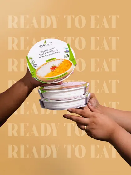 A dynamic shot featuring hands passing a ready-to-eat meal. This creates a sense of sharing and convenience, while the repeated text in the background reinforces the product's key selling point.