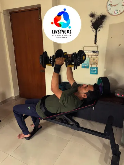 Another client performs an incline dumbbell press, targeting the upper chest muscles. Using adjustable dumbbells allows us to progressively increase the challenge as he gets stronger.