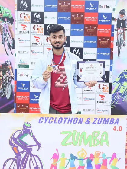 Proudly holding the medal and certificate after a successful Cyclothon and Zumba event at Decathlon. We give our all to every event we are a part of.