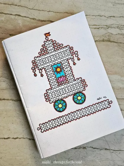 A painting inspired by the intricate 'kollam' or 'rangoli' patterns made for the Ratha Saptami festival. This piece, done on a book cover, celebrates the traditional art of drawing complex designs on the floor.