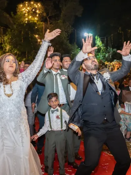 The grand entrance with hands in the air! This shot perfectly captures the celebratory mood as the couple and their page boy enter the reception.