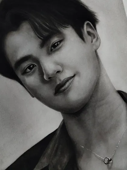 Another portrait I drew of the kindest soul, Ohm Pawat. This detailed graphite drawing focuses on capturing his gentle expression.