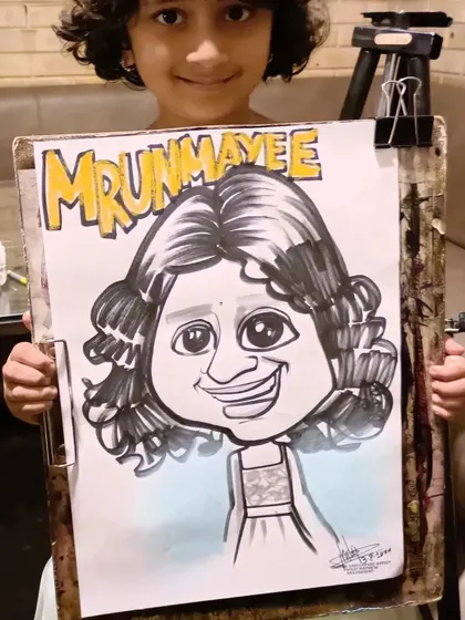 A little girl named Mrunmayee with her personalized caricature.