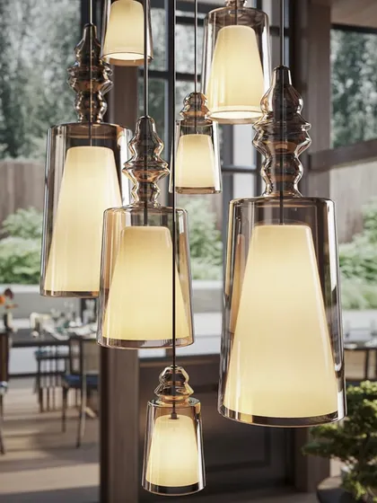 A close-up of a dense cluster of the pendants. This view highlights the beautiful details of the glass and the warm, inviting light they produce.