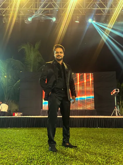 Awaiting the start of an outdoor Sangeet. The stage is set, the lights are on, and I'm ready to bring the energy for a night of performances and dancing.