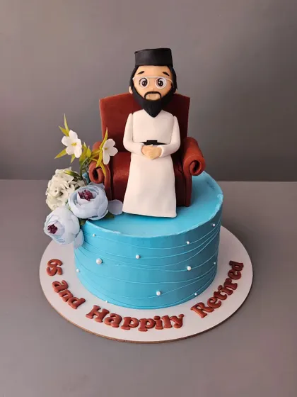 A retirement cake for a pastor. This cake features a custom figurine and celebrates the beginning of a new adventure.