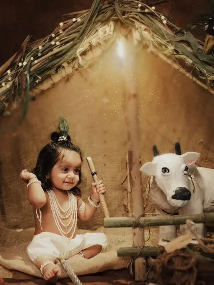 Little Krishna with his flute, ready to play a sweet melody. This shot captures the innocent and divine essence of the theme.