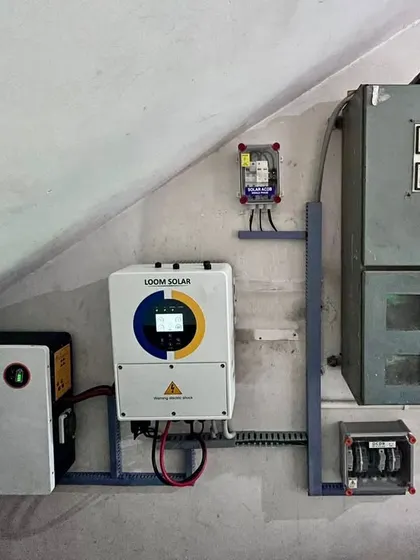 The indoor unit for the Ranchi hybrid system, featuring our inverter and a wall-mounted CAML battery. This setup is designed to handle frequent power outages common in the area.