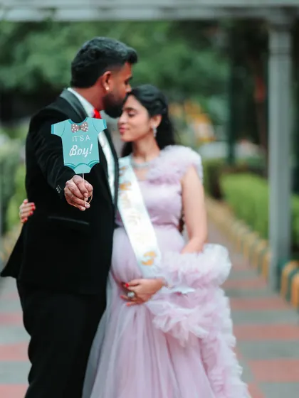 And it's a boy! Another wonderful way to announce the big news during a maternity shoot. The couple looks so happy and excited for their new arrival.