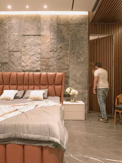 The hidden door in action. This image shows how the fluted panel opens to reveal a passage, maintaining the clean aesthetic of the bedroom when closed.