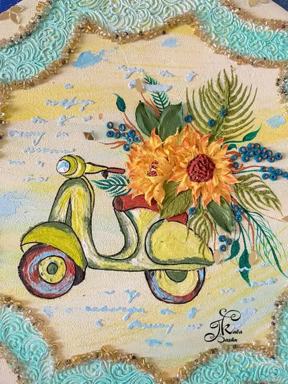 A close-up of a unique wall art piece featuring a vintage scooter ("Papaji ka scooter") with a basket of sculpted sunflowers.
