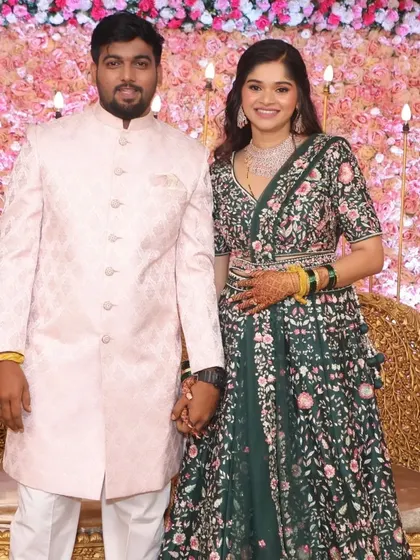 Another beautiful portrait of the happy couple. Her dark green lehenga and soft makeup create a look that is both traditional and modern.