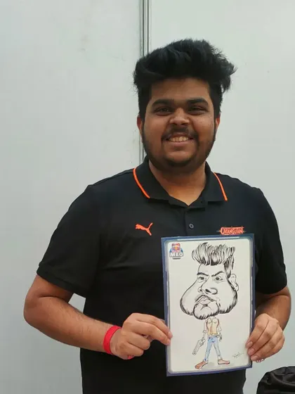 A happy gamer with his caricature, a cool souvenir from the Redbull esports tournament.