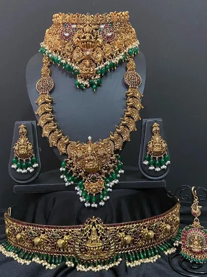 The full Nagas bridal set, showcasing the layered effect of the choker and long necklace. This is a powerful and traditional look for any South Indian bride.