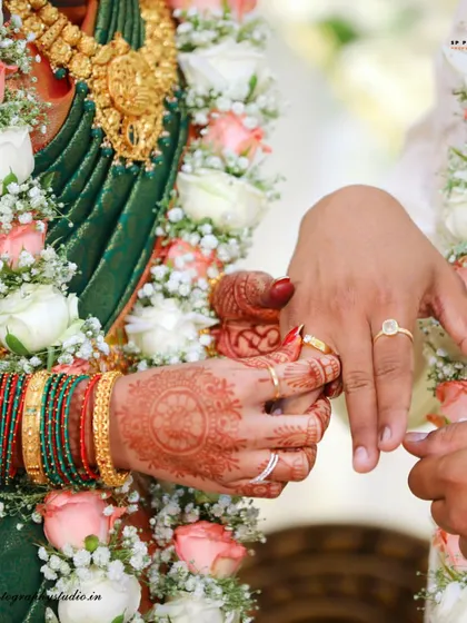 A close-up of the engagement ring being placed on the bride's finger. We focus on capturing this pivotal moment with clarity and emotion.