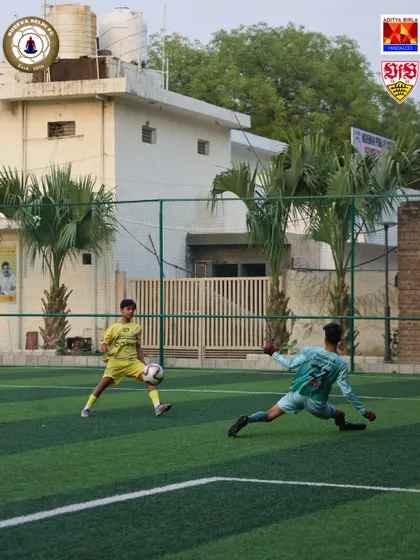 A player takes a shot while the goalkeeper dives to make a save. These one on one scenarios are a crucial part of our training, building confidence for both the attacker and the keeper.