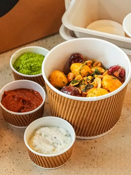 A hearty bowl of our baby potato starter, packed with its trio of chutneys and sauces. We make sure you have everything you need to recreate the full flavor experience at home.
