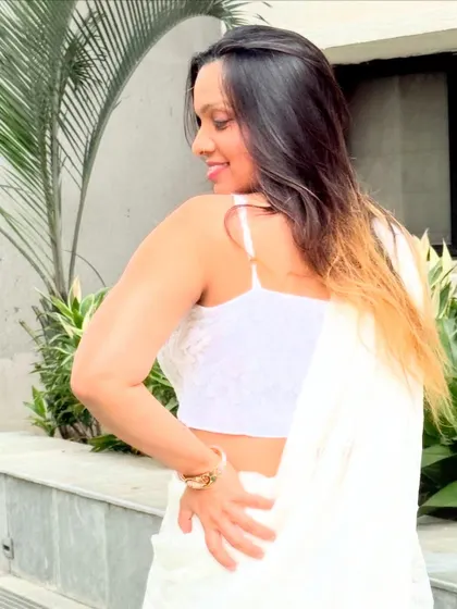 A playful shot showing the back and shoulder detail of this creative drape.