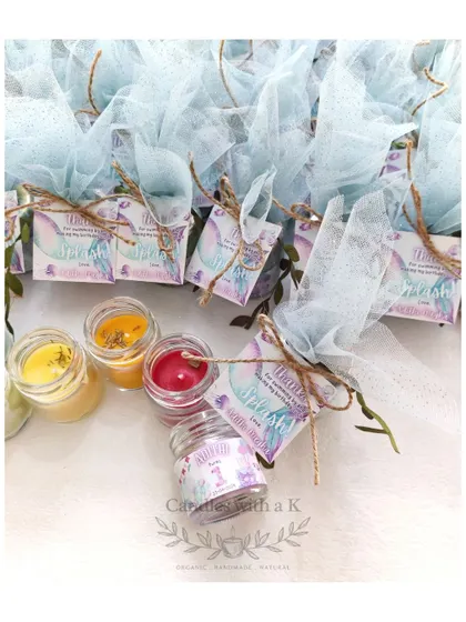 A small collection of the mermaid-themed candles, showing the different colors and scents chosen for the party.