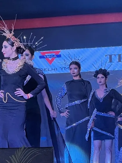 Models present a cohesive collection from 'The Dark Side' theme, showcasing avant-garde headpieces and dramatic silhouettes on the Memorabilia 2024 runway.