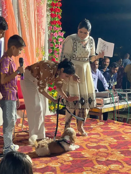 A smaller participant, a lovely Shih Tzu, gets judged on the stage. We ensure that events are managed to be safe and comfortable for pets of all sizes and temperaments.