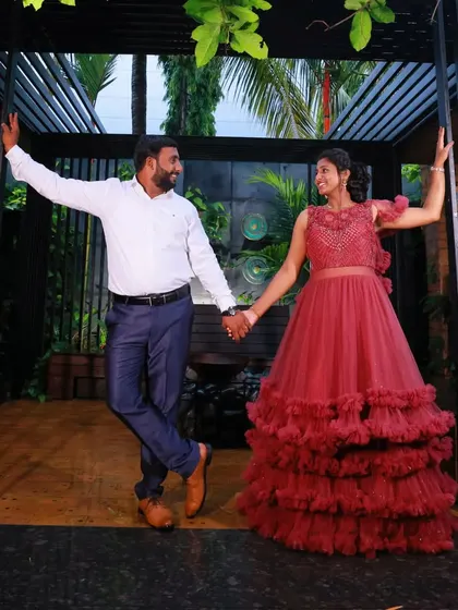 A fun, dancing pose from the same pre-wedding session. The ruffled gown moves beautifully, making it a great choice for dynamic and joyful shots.