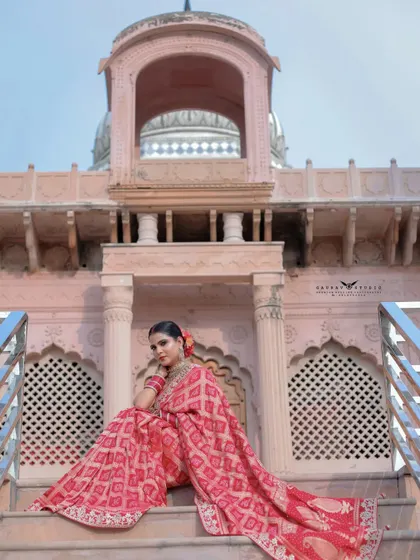 Another seated portrait from a lower angle, emphasizing the grandeur of the architecture behind her. The composition makes her look like royalty.