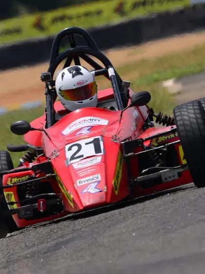 A close-up action shot of our Formula LGB car, highlighting the driver's focus and the car's performance.