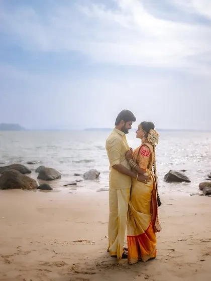 A candid embrace on the beach. I aim to capture these unposed moments where the couple's love for each other is evident in their relaxed posture and genuine smiles.